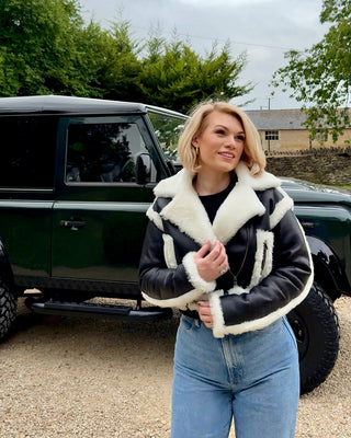 Women’s Black Cropped Sheepskin Jacket with White Shearling Trim, Belt & Zip Fastening – Luxury Cropped Shearling Coat